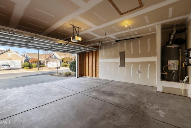 garage featuring a garage door opener, water heater, and electric panel