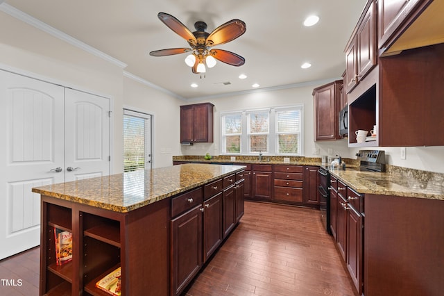 kitchen with a center island, dark hardwood / wood-style flooring, crown molding, stainless steel electric range, and light stone countertops