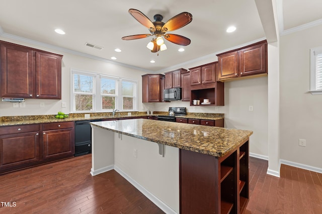 kitchen with a center island, dark stone counters, dark wood-type flooring, black appliances, and crown molding