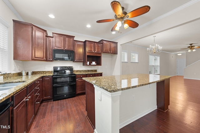 kitchen with dark hardwood / wood-style flooring, black appliances, light stone countertops, sink, and crown molding