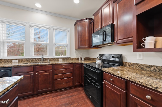 kitchen featuring dark stone countertops, sink, crown molding, black appliances, and dark hardwood / wood-style flooring