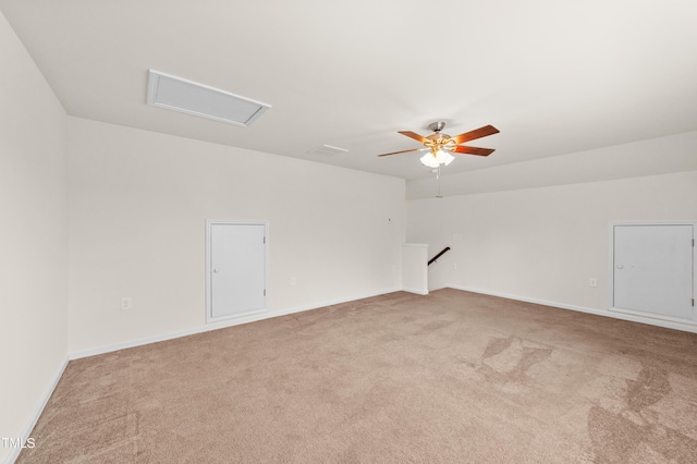 empty room featuring ceiling fan and carpet floors