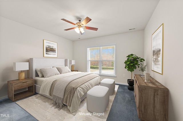 bedroom with ceiling fan and carpet floors