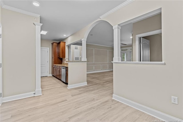 interior space with light hardwood / wood-style floors, ornamental molding, sink, and stainless steel dishwasher