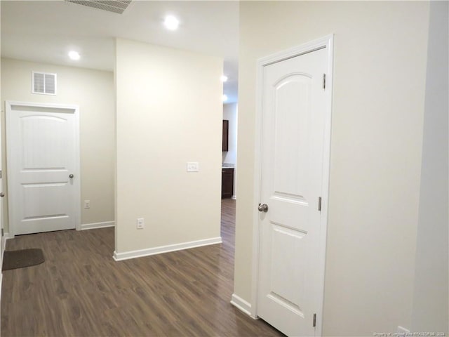 hall with dark hardwood / wood-style flooring