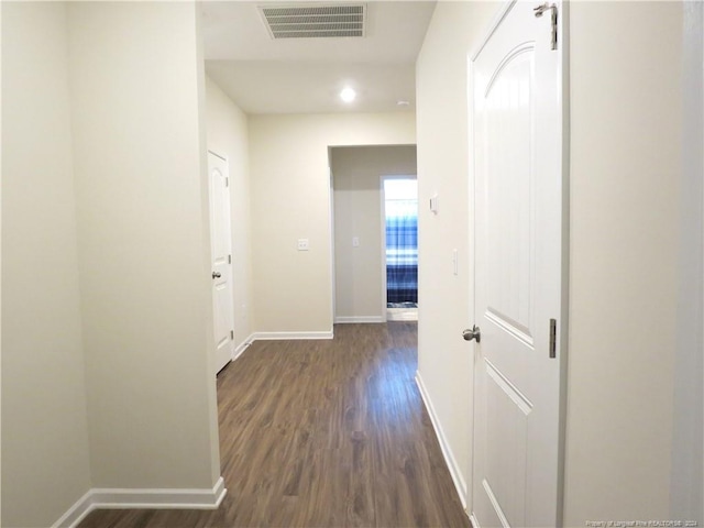 hall with dark hardwood / wood-style floors