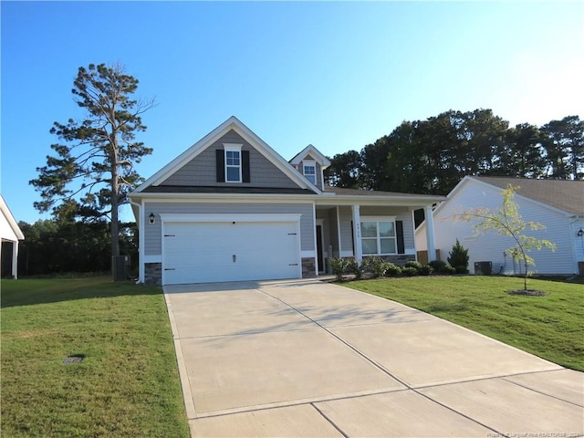 view of front of property with a garage and a front lawn