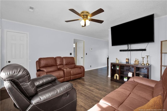 living room featuring ornamental molding, dark hardwood / wood-style flooring, and ceiling fan