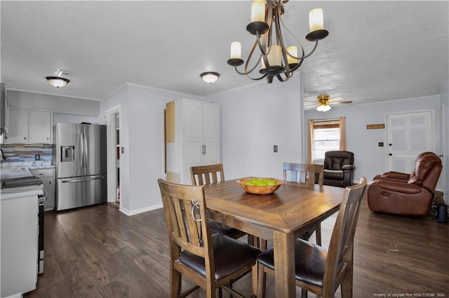 dining room featuring ceiling fan with notable chandelier, dark wood-type flooring, ornamental molding, and a textured ceiling