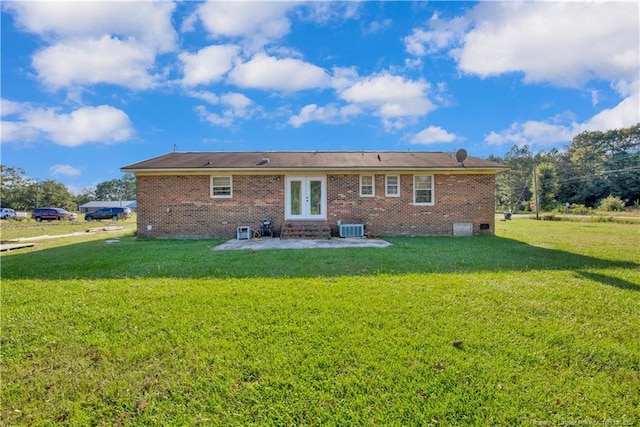 back of house with a yard, central AC, and a patio