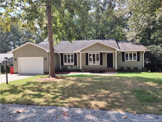 ranch-style house featuring a garage and a front yard