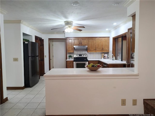 kitchen featuring light tile patterned flooring, decorative backsplash, kitchen peninsula, ornamental molding, and appliances with stainless steel finishes