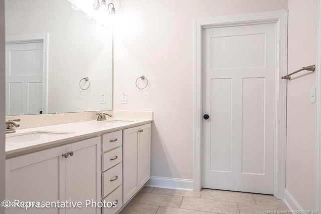 bathroom featuring tile patterned floors and vanity