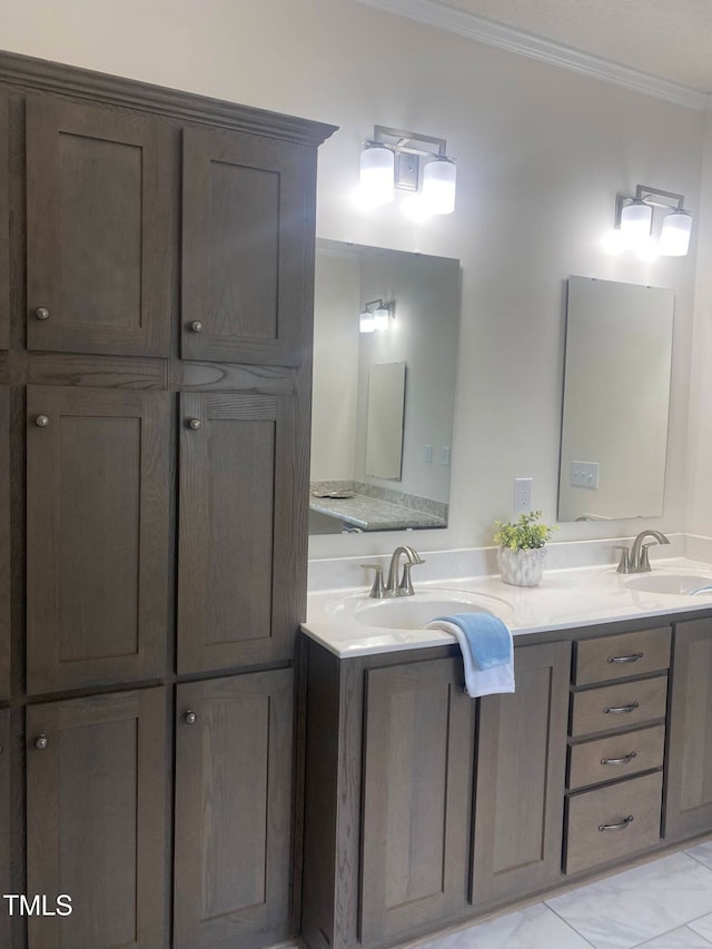 bathroom with ornamental molding and vanity