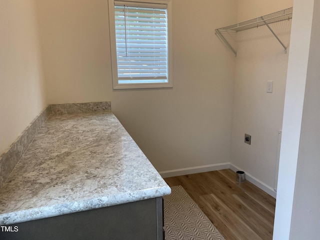 6733 Oscar Barham Rd, Wake Forest, NC 27587 - laundry room featuring wood finished floors, hookup for an electric dryer, healthy amount of natural light, and baseboards