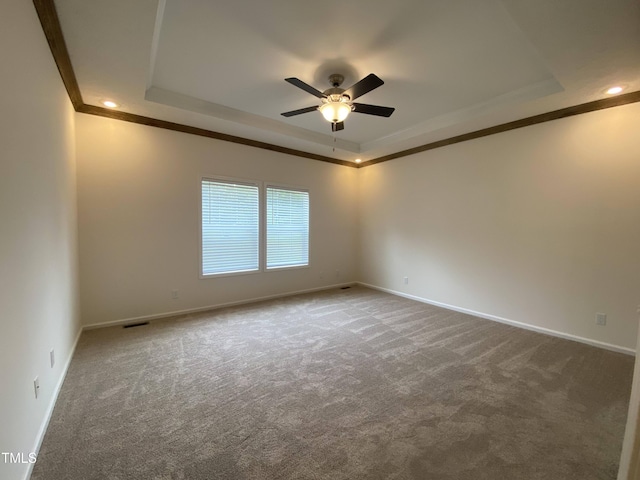 6733 Oscar Barham Rd, Wake Forest, NC 27587 - empty room with a tray ceiling, ornamental molding, ceiling fan, carpet flooring, and baseboards