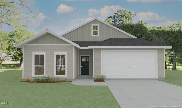 view of front of property with a front yard and a garage