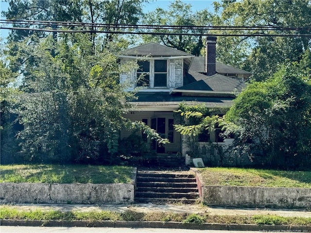 501 Iona St, Fairmont, NC 28340 - view of front of house with a chimney and a front yard