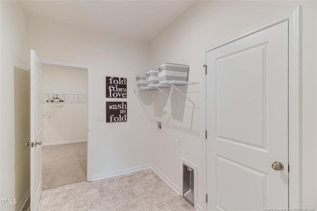 washroom featuring laundry area, washer hookup, and baseboards
