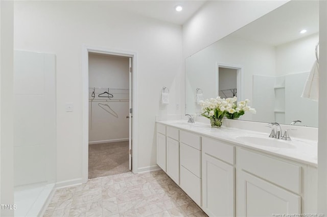 bathroom featuring vanity and walk in shower