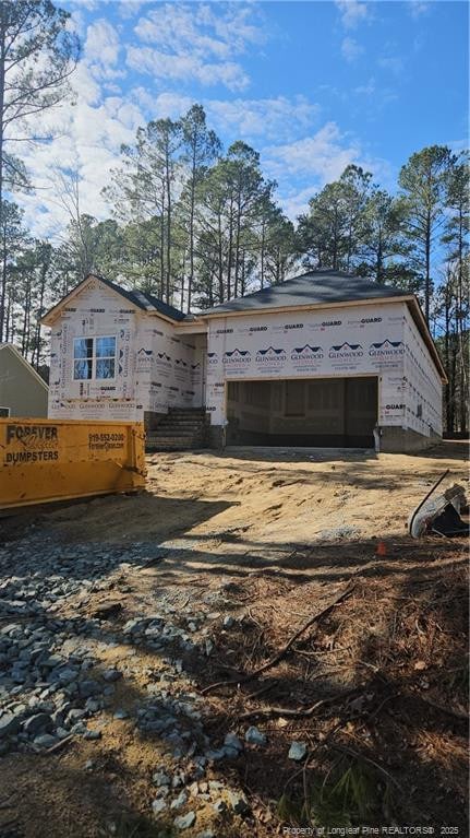 view of side of home with a garage