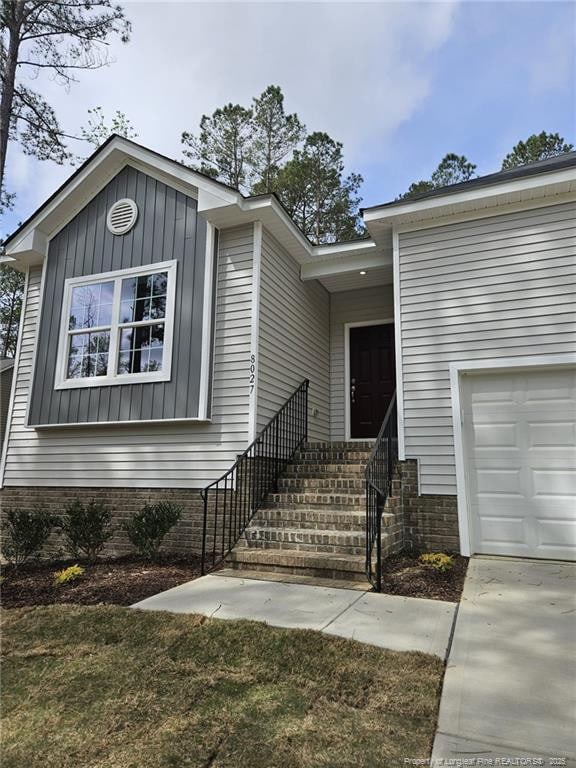 view of front of house featuring board and batten siding and a garage