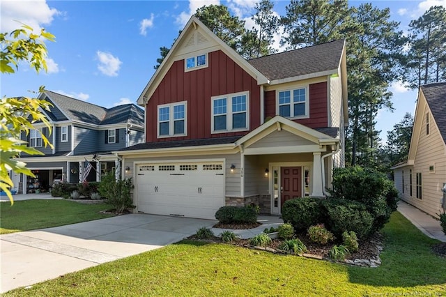 craftsman-style home featuring a front yard and a garage