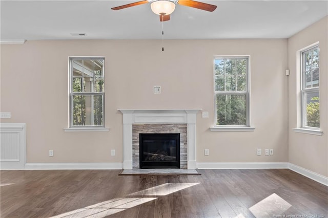 unfurnished living room featuring hardwood / wood-style floors and a wealth of natural light