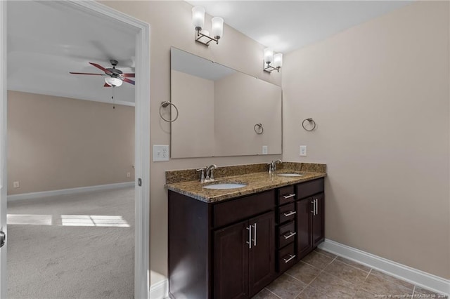 bathroom with ceiling fan, tile patterned flooring, and vanity