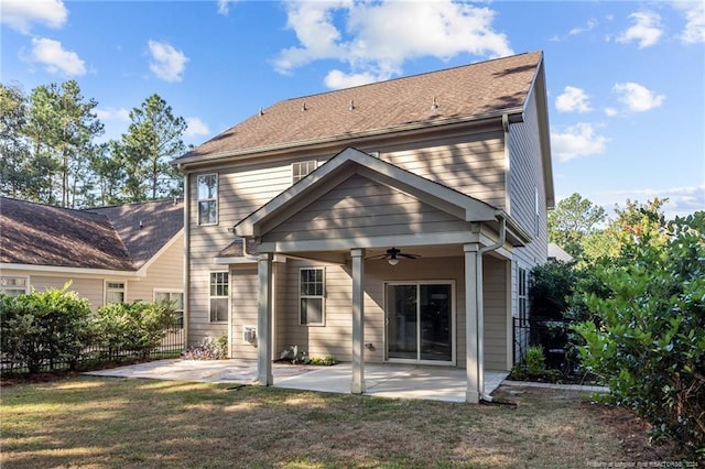 rear view of house with a yard, ceiling fan, and a patio