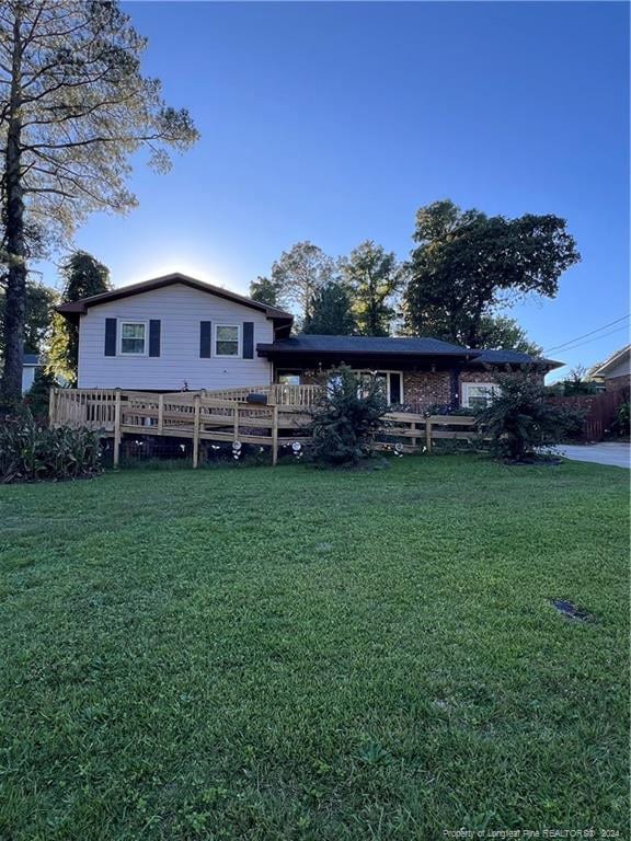 back of house featuring a yard