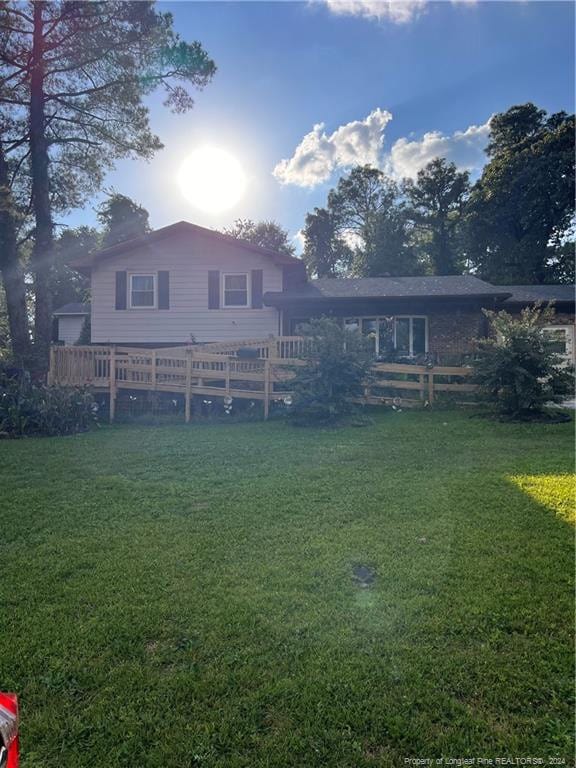 back of house featuring a yard