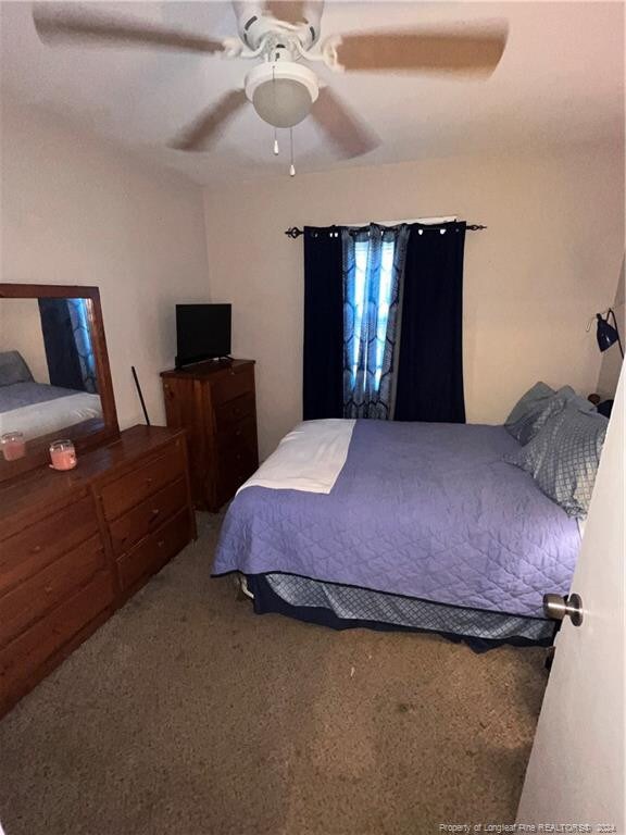 bedroom featuring ceiling fan and carpet floors