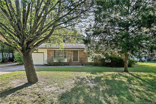 view of front facade with a front yard and a garage