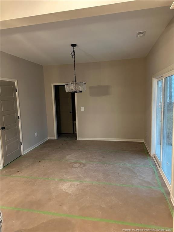 unfurnished dining area with concrete floors