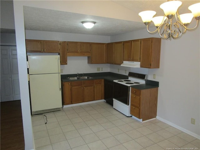 kitchen featuring light tile patterned flooring, white appliances, sink, and an inviting chandelier