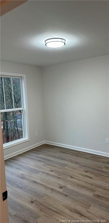 empty room with wood-type flooring