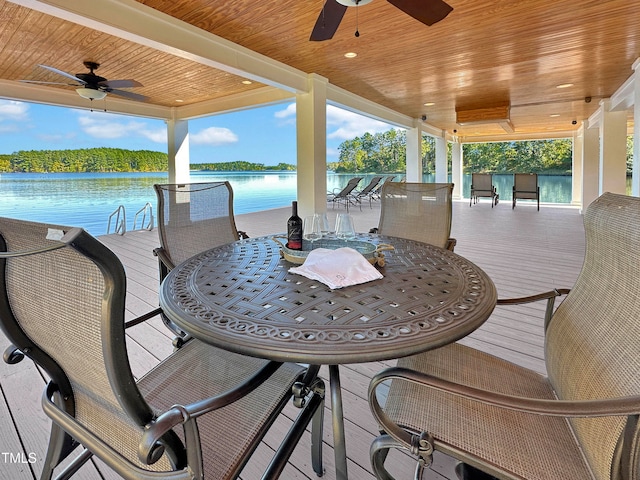 exterior space featuring a water view and ceiling fan