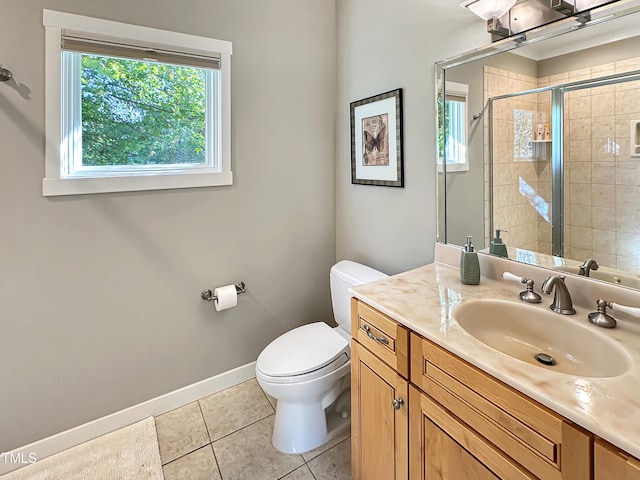 bathroom featuring vanity, toilet, tile patterned floors, and an enclosed shower