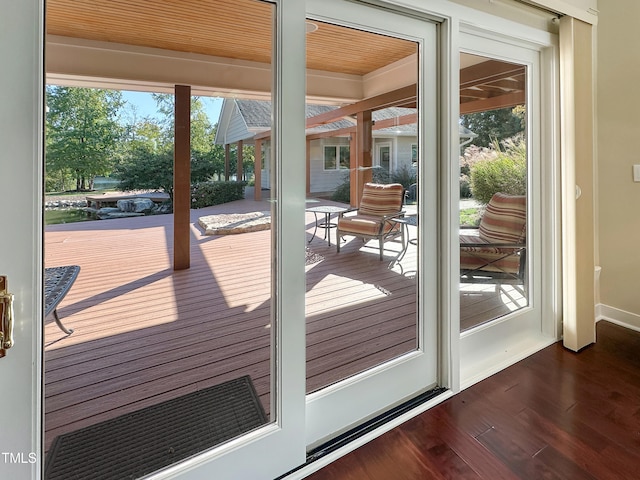 entryway featuring dark hardwood / wood-style floors and wooden ceiling