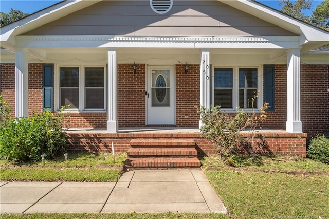 entrance to property with covered porch