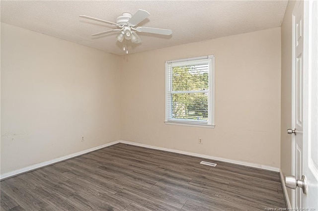 unfurnished room with ceiling fan, dark hardwood / wood-style floors, and a textured ceiling