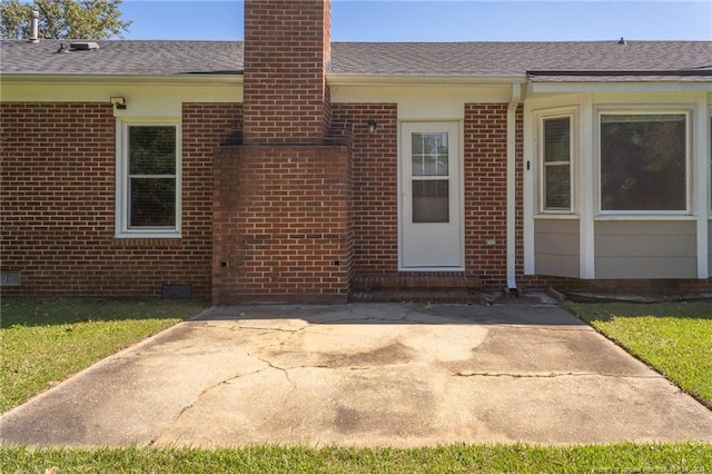 property entrance with a patio