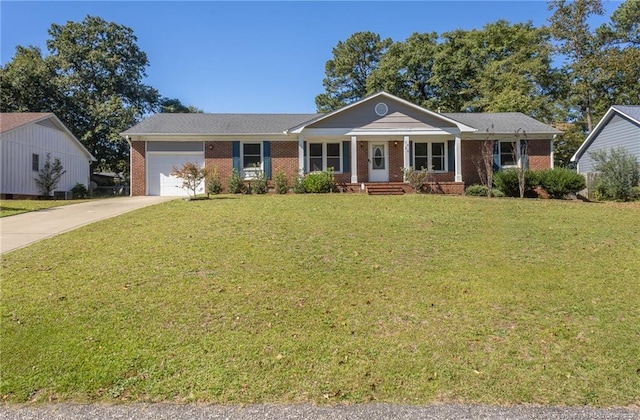 ranch-style home with a garage, a front lawn, and covered porch