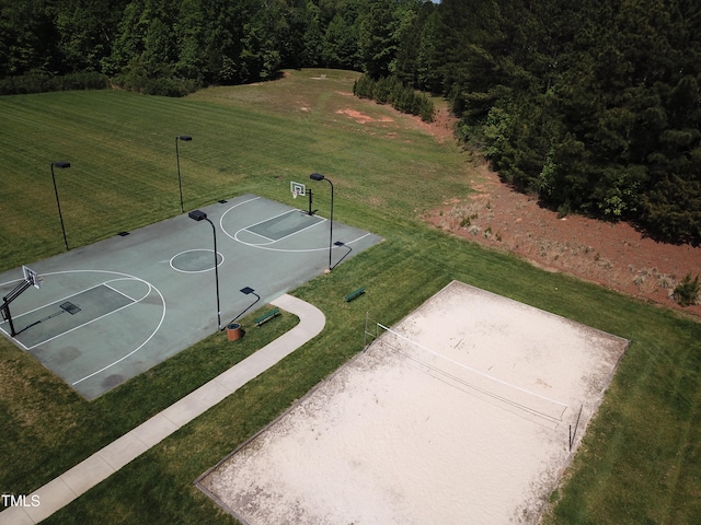 view of basketball court featuring a lawn