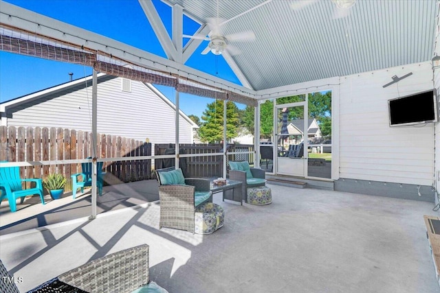 view of patio with ceiling fan and fence