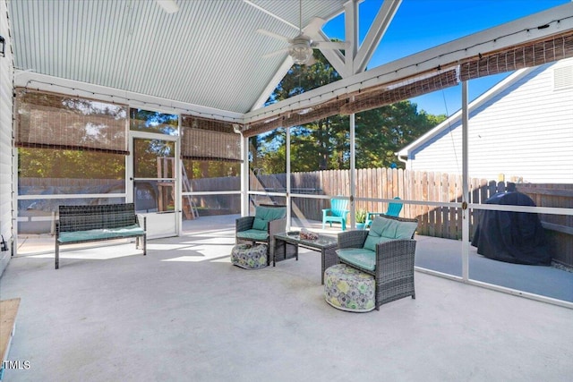 sunroom with lofted ceiling and ceiling fan