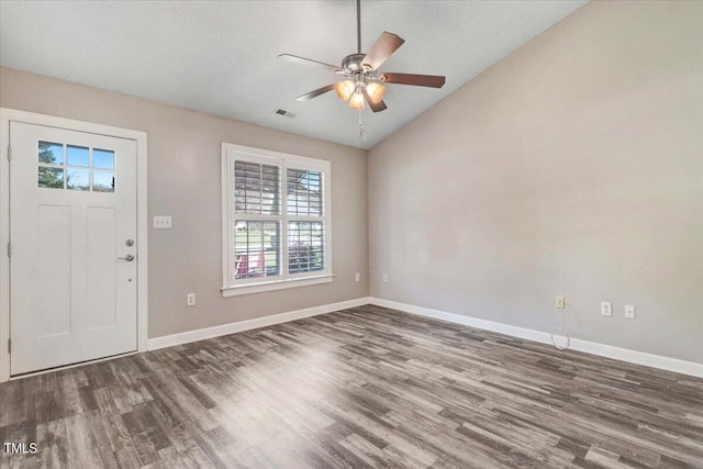 entrance foyer featuring vaulted ceiling, ceiling fan, and dark hardwood / wood-style flooring