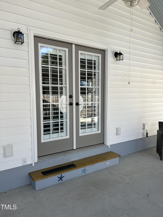 doorway to property with french doors and ceiling fan