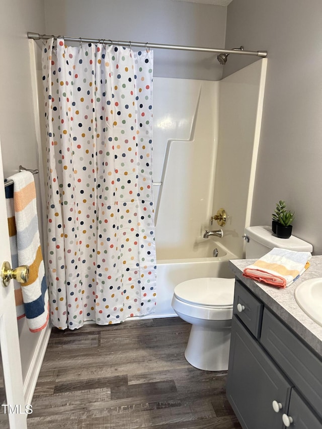 full bathroom featuring shower / bathtub combination with curtain, vanity, toilet, and wood finished floors